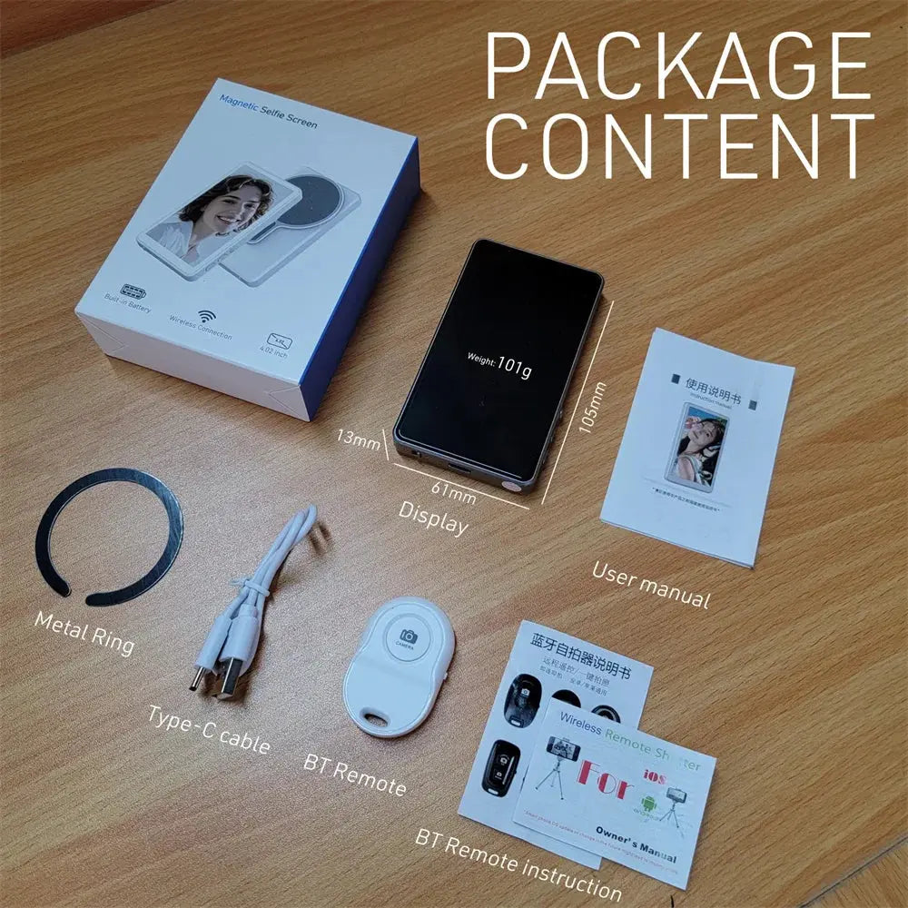 Package content of a device with box, screen, remote control, cable, and manual on a wooden surface.