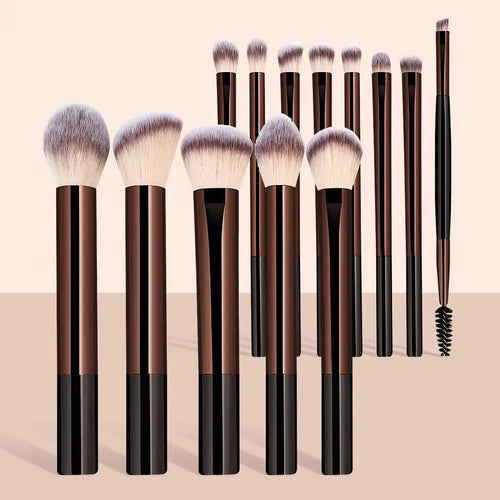 Set of makeup brushes with black and brown handles on a beige background