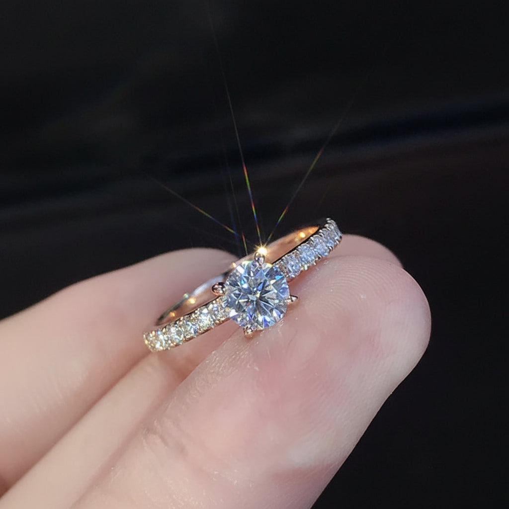 Diamond ring on a finger with a dark background