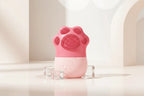Pink silicone paw-shaped product on a white background