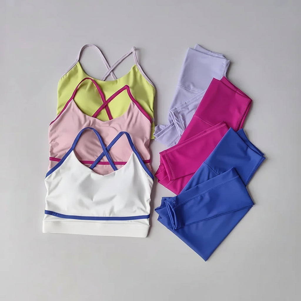 Colorful sports bra and leggings set on a gray background
